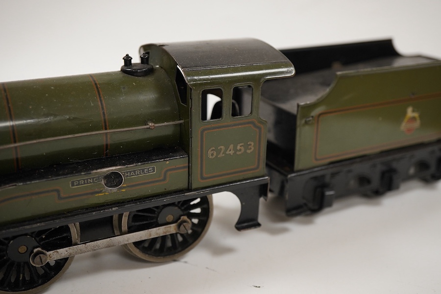 An 0 gauge Bassett-Lowke clockwork tinplate BR 4-4-0 tender locomotive, Prince Charles 62453, in dark green livery with orange and black lining and original clockwork mechanism